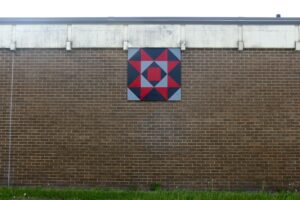Barn Quilt named Teachers hangs on Staples Elementary.