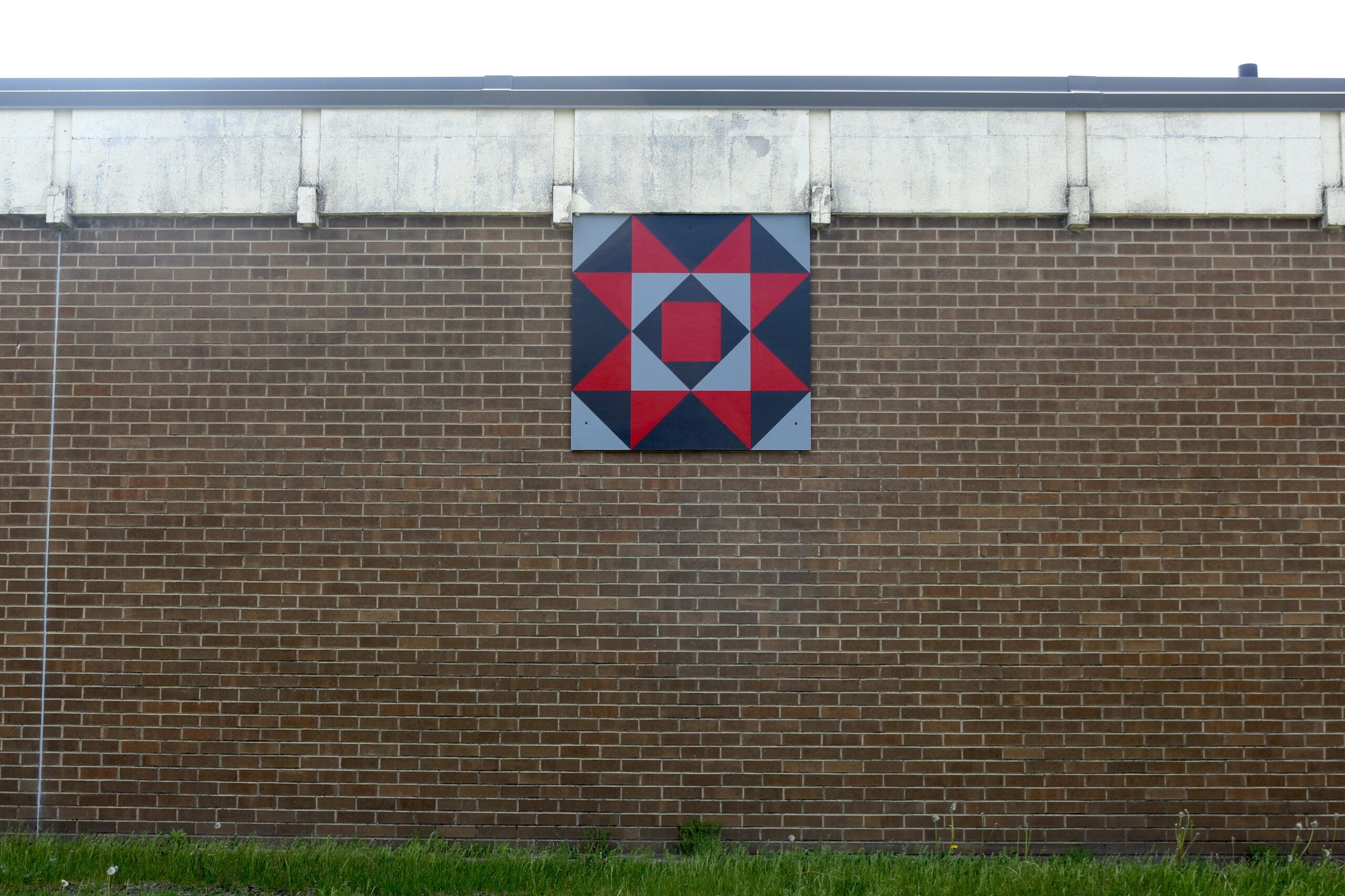 Barn Quilt named Teachers hangs on Staples Elementary.
